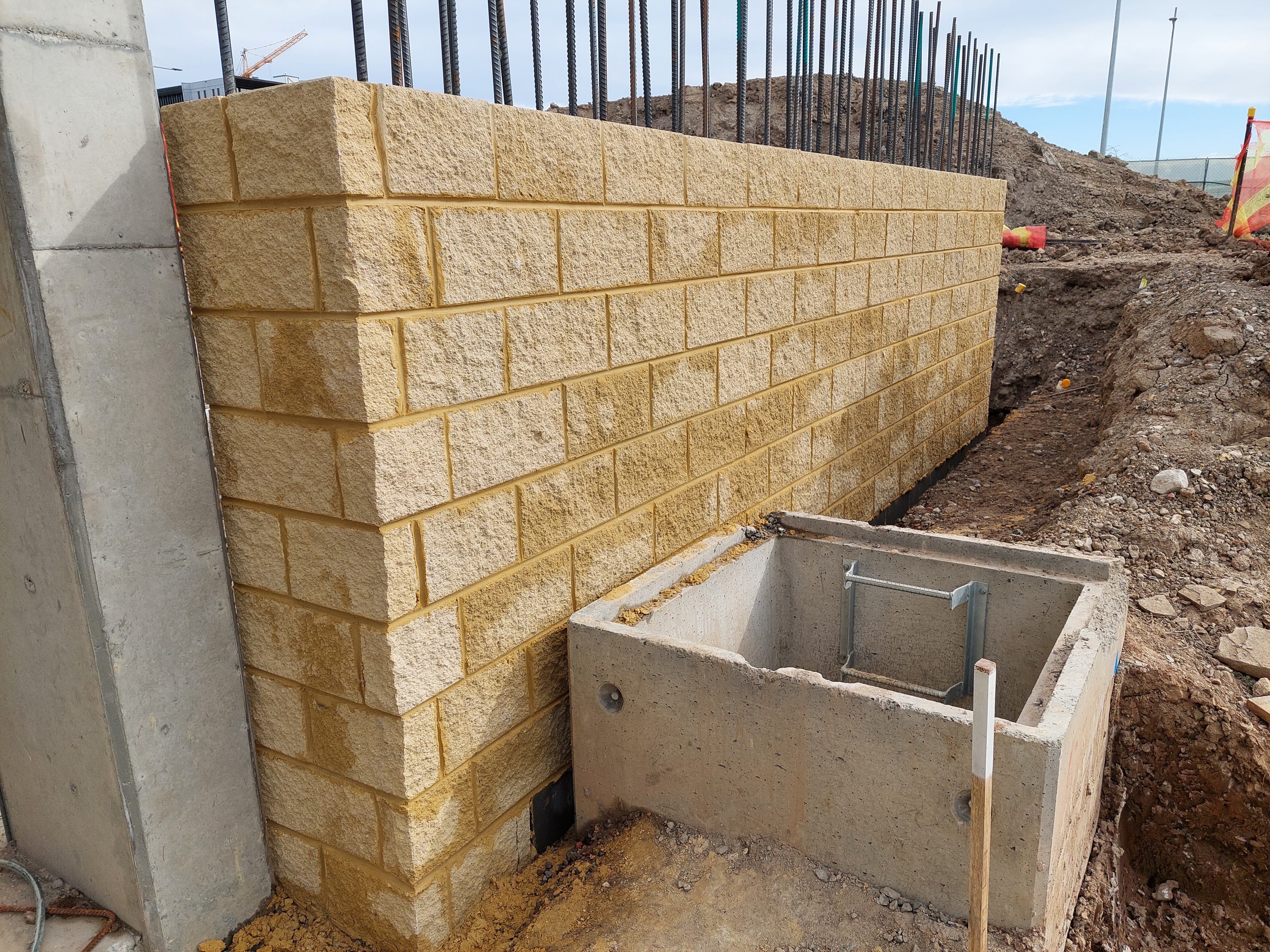 Craftsperson laying bricks